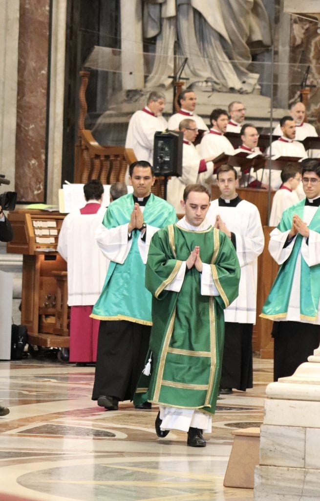 Seminarian Shane Costello leads the entrance procession